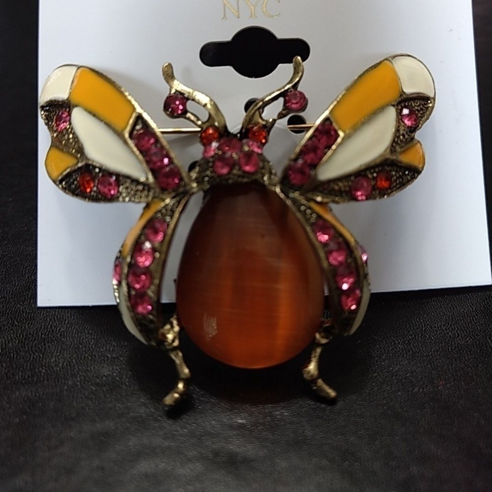 Signature NYC gold tone bug brooch